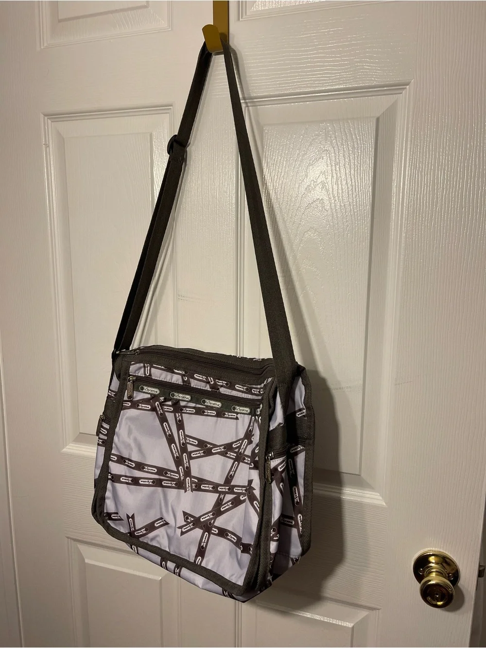 Lesportsac White and Brown Patterned Messenger Bag